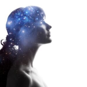 Cosmic silhouette of a woman with a starry galaxy in her thoughts.